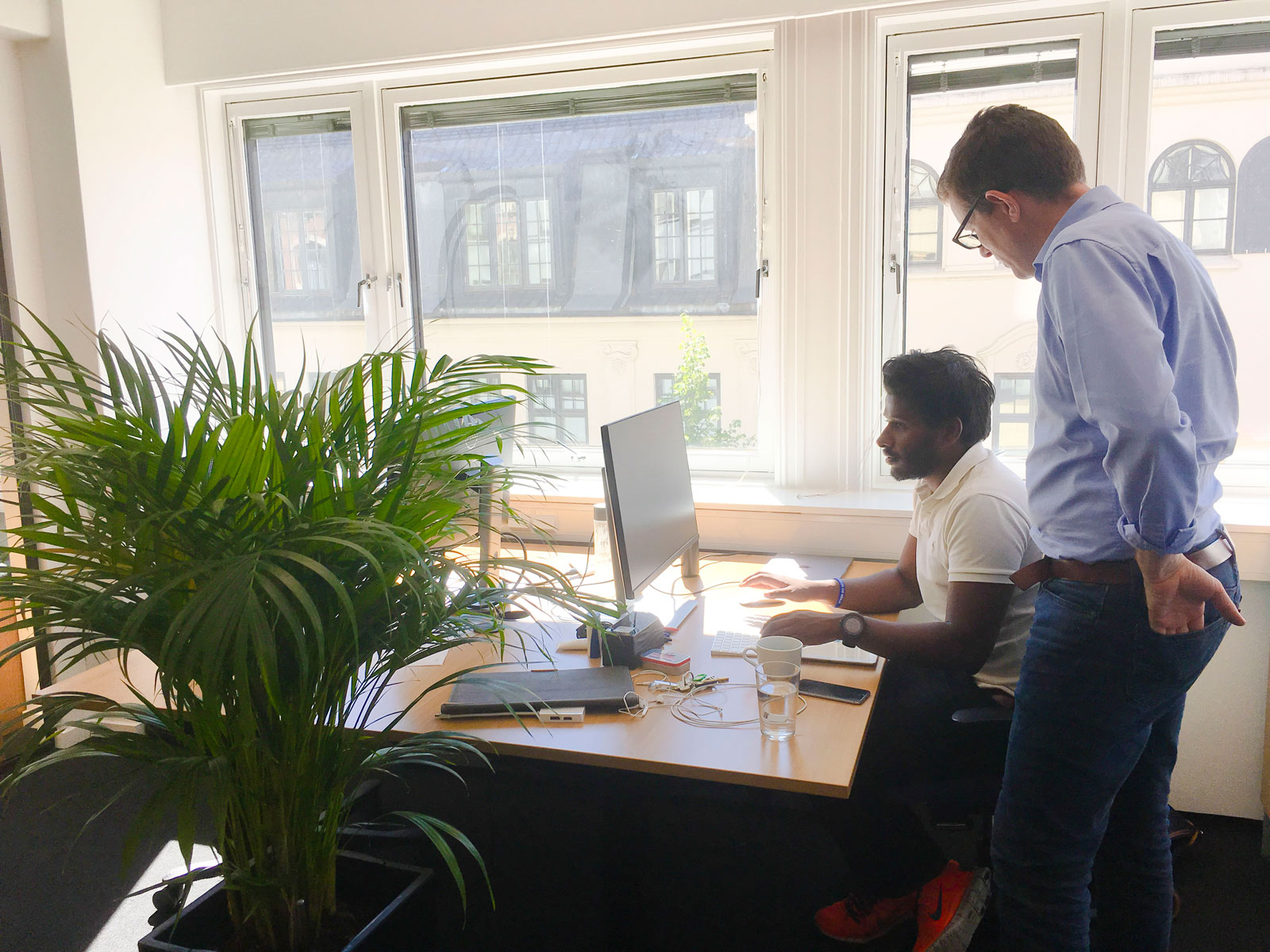 Two Gture employees working with digital transformation in the Gture office